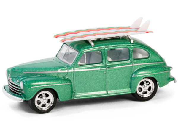 Greenlight 1/64 The Hobby Shop Series 16 - 1946 Ford Fordor Super Deluxe Green Metallic with White Interior and Roof Rack with Surfboards 97160-A